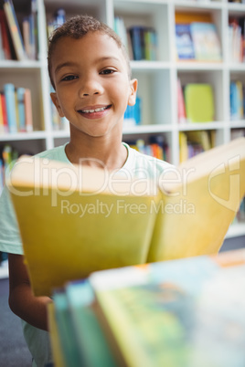 Little boy reading a book