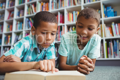 Little boys reading a book