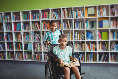 Little boys holding a book