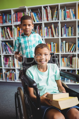 Little boys holding books