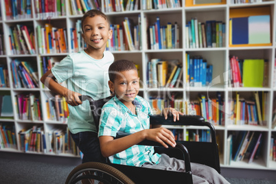 Boy pushing the wheelchair
