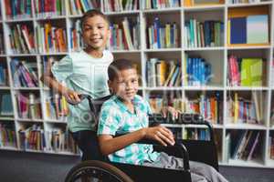 Boy pushing the wheelchair