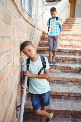 Boy pointing on another boy