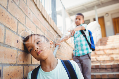 Boy pointing on another boy