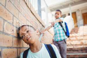 Boy pointing on another boy