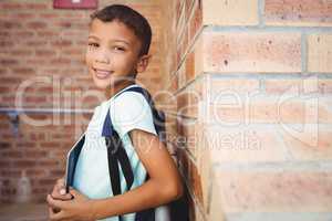 Smiling schoolboy looking at the camera