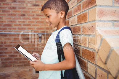 Schoolboy using a digital tablet