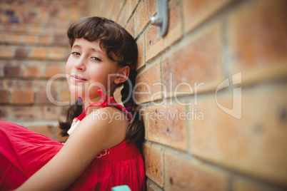 Seated brunette girl looking at the camera