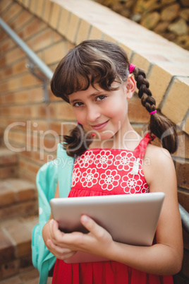 Schoolgirl with a digital tablet