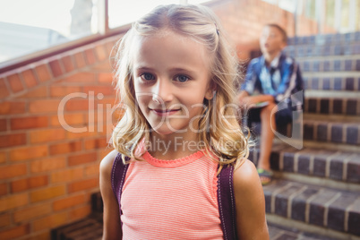 Cute little blonde girl looking at the camera