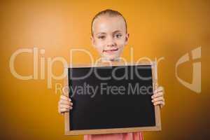 Little girl holding a blackboard