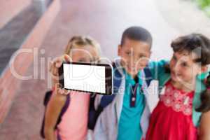 Three schoolkids taking a selfie