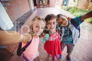 Three kids photographed like a selfie