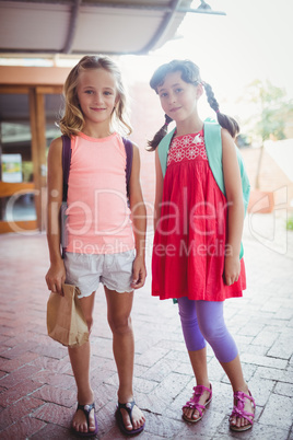 Two cute smilling little girl posing