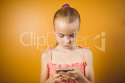 Blonde girl using her smartphone