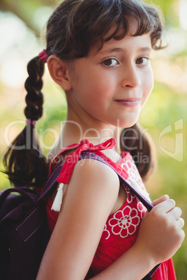 Girl holding strap of her bag