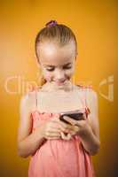 Blonde girl using her smartphone
