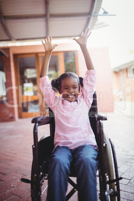 Smiling girl siting in a wheelchair