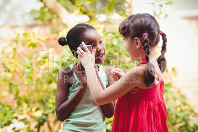 Two girls with a smartphone