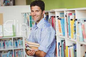 Portrait of a men holding books