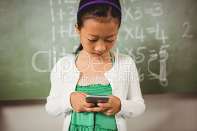 Schoolgirl using her smartphone
