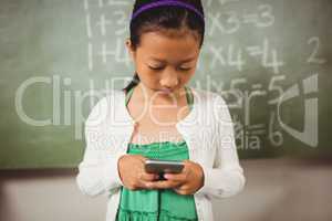 Schoolgirl using her smartphone