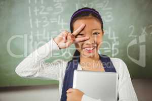 Cute schoolgirl doing the peace sign