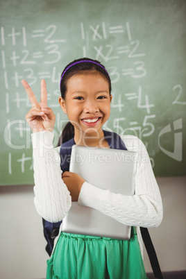 Schoolgirl doing the peace sign