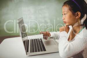 Cute girl using a laptop