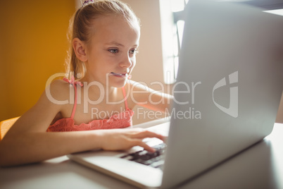 Cute girl looking her computer screen