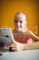 Cute girl using digital tablet