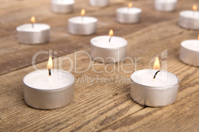 Candles on wooden background