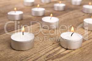 Candles on wooden background