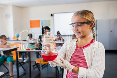 A cute pupil posing with beaker