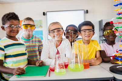 Smiling pupils doing science