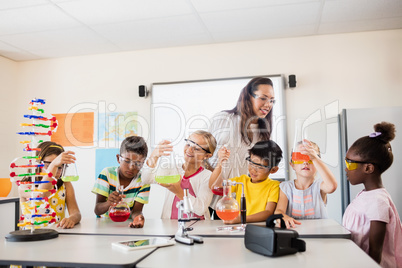 Smiling children doing science