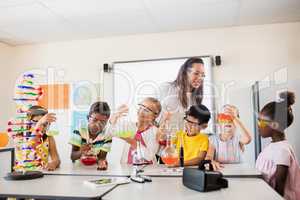 Smiling children doing science