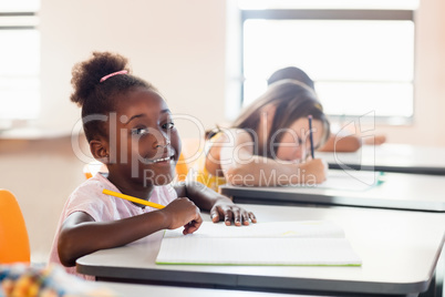 A smiling pupil posing for the camera