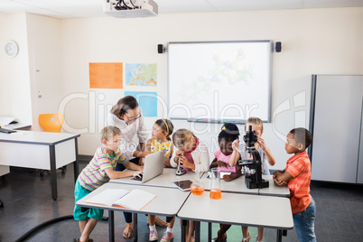 Teacher having science lesson