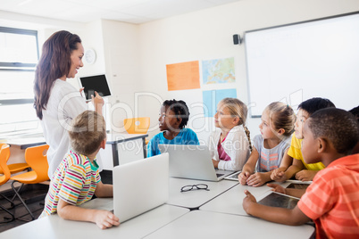 A teacher giving lesson with technology