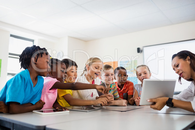 A teacher giving lesson with tablet computer