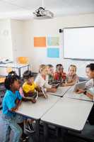 Pupils listening the teacher using tablet pc