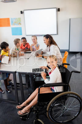 Cute girl in wheelchair posing for the camera