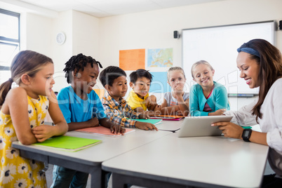 A teacher giving lesson with tablet computer