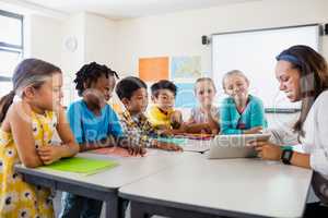 A teacher giving lesson with tablet computer