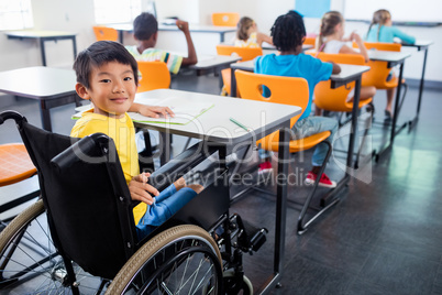 A cute people in wheel chair looking at the camera