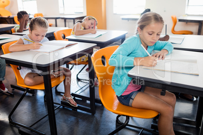 Pupils studying at at their desk
