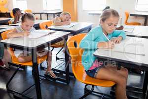 Pupils studying at at their desk