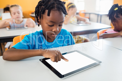 Pupil using a tablet pc in classroom