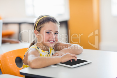 Little girl posing with tablet pc